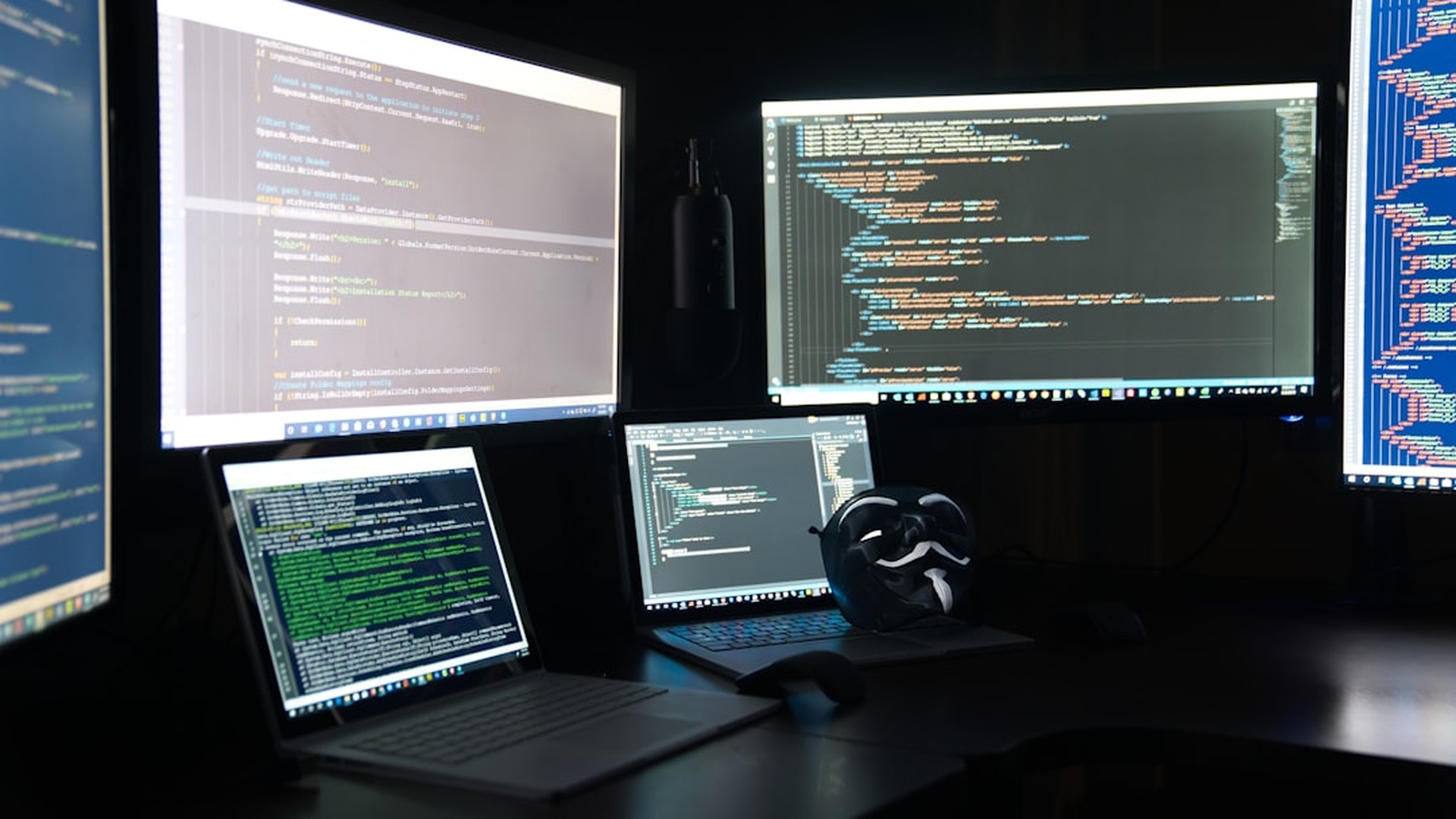 Professional developers coding blockchain applications with multiple monitors showing smart contracts and Web3 interfaces